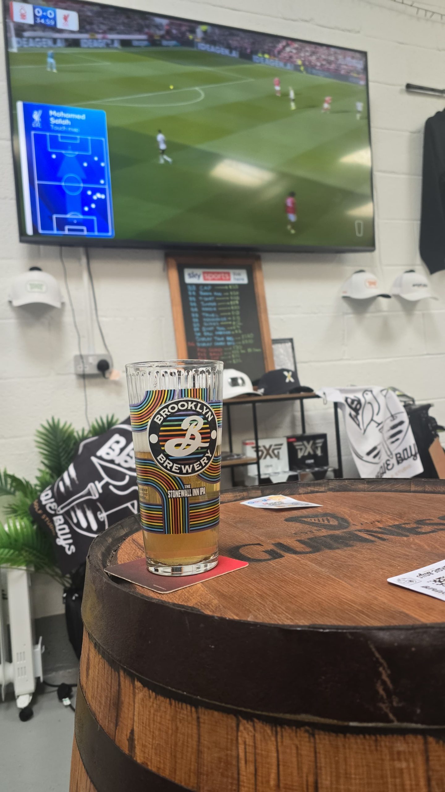 Birdie Bays bar and social area with oak barrel tables
